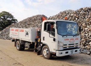 Finally the delivery trucks are filled with logs, bagged or loose.